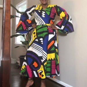Elegant African wrap dress with bell sleeves.